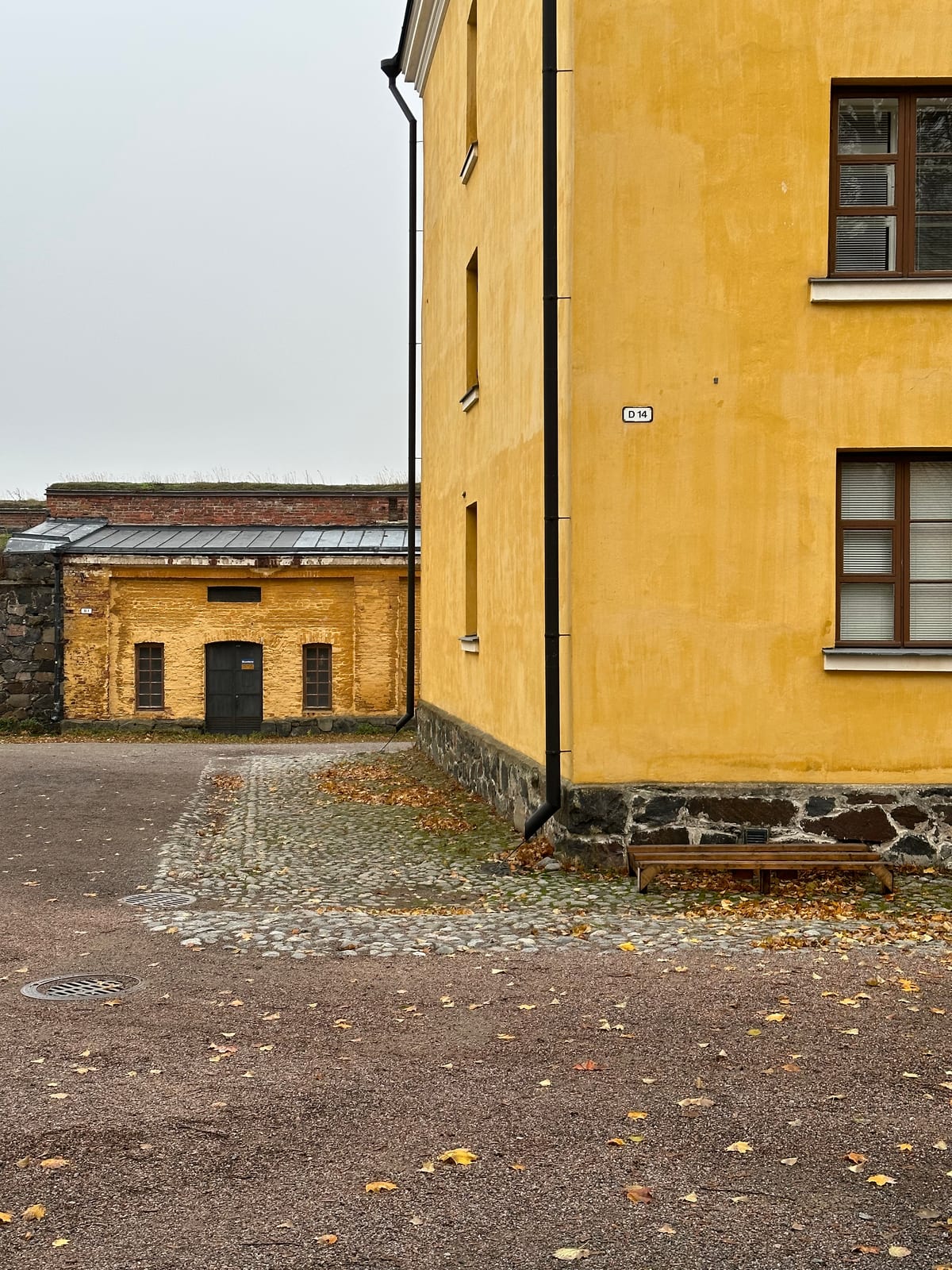Two bright-yellow buildings of the naval academy