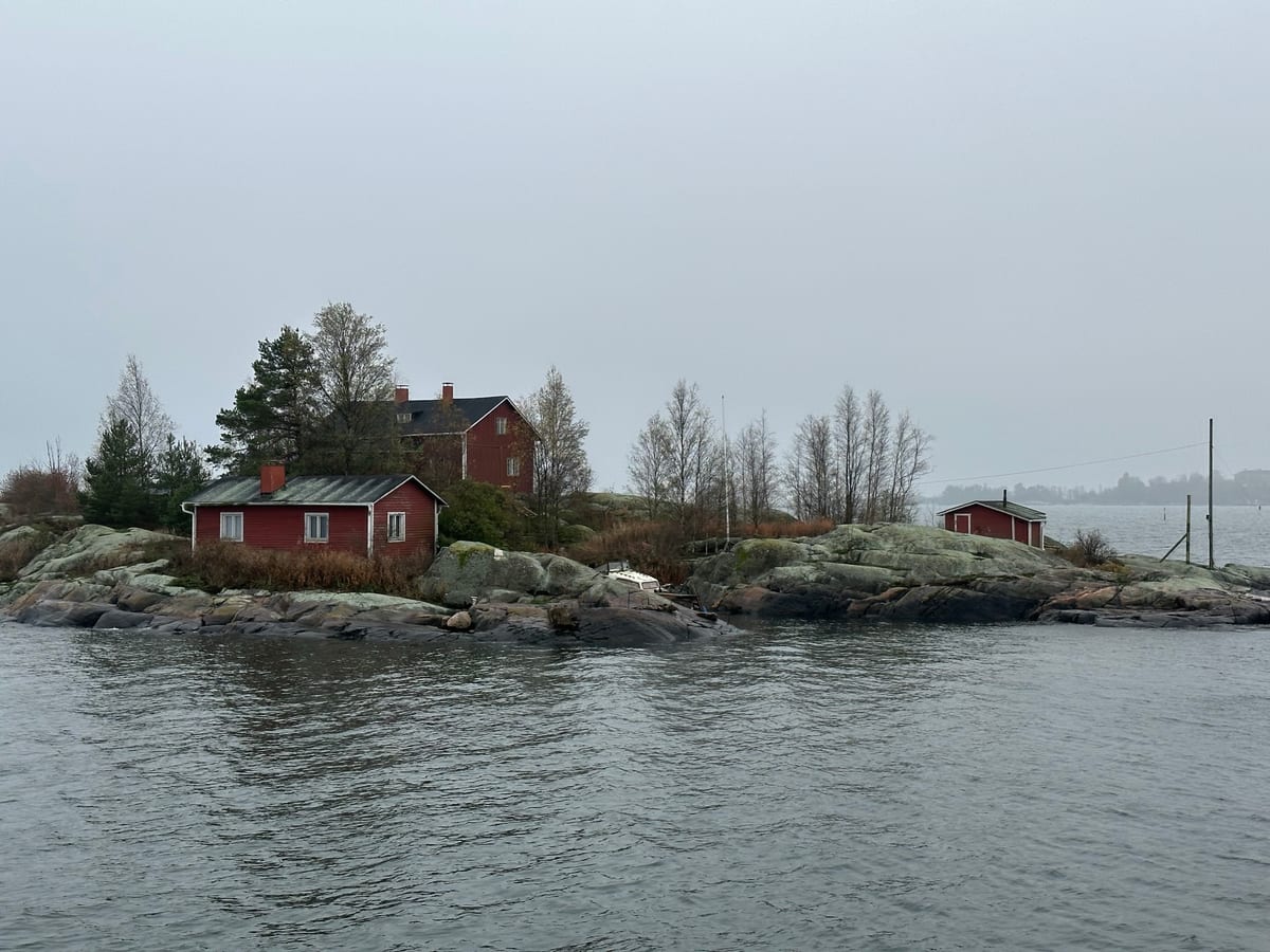 A beautiful, red painted, wooden house on a small island right outside the Helsinki harbor