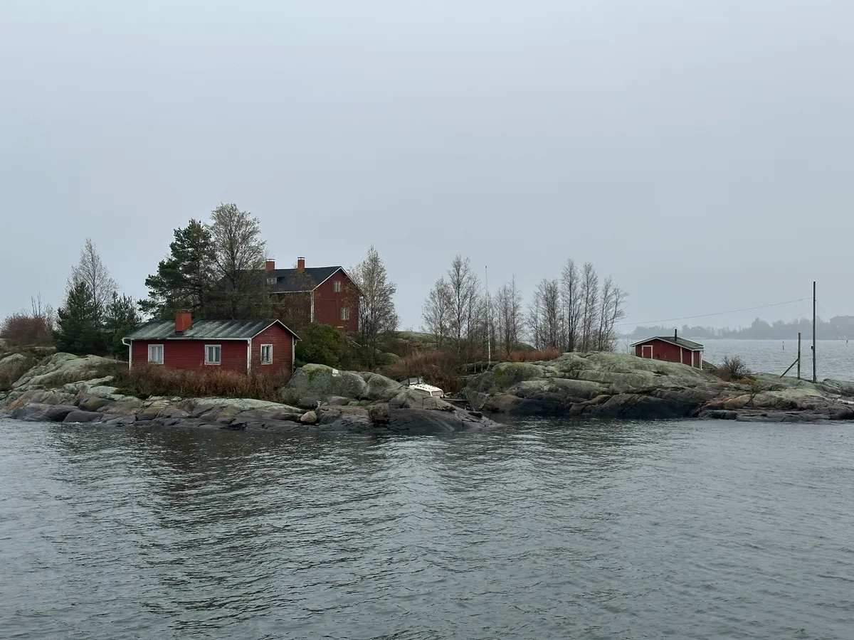 A beautiful, red painted, wooden house on a small island right outside the Helsinki harbor