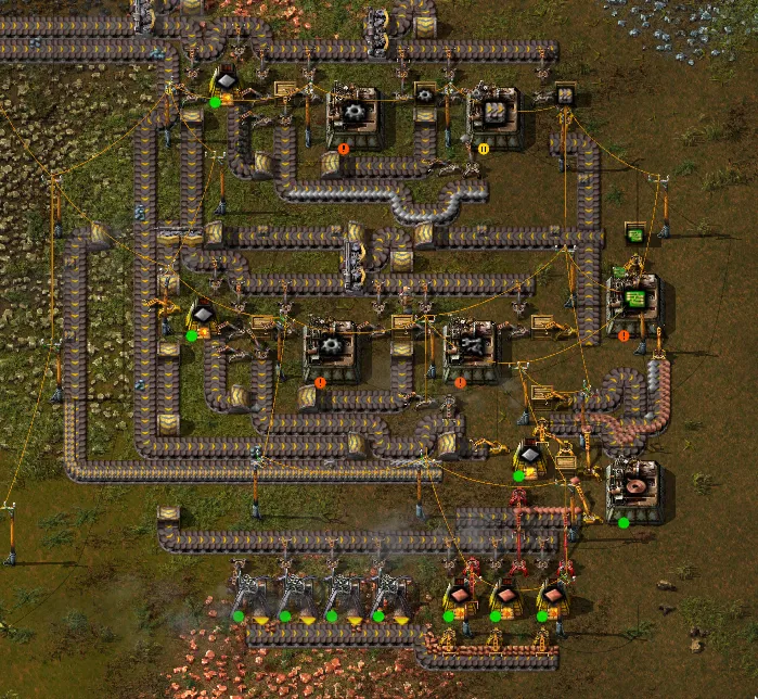 What it looks like when you squeeze in conveyors and duplicate parts of the factory. There are two assemblers making gears, and two furnaces making iron plates. And everything is covered in conveyor belts.