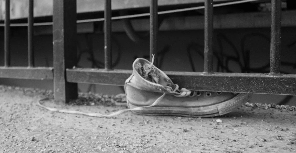 A shoe stuck in the railing of a bridge in Stockholm